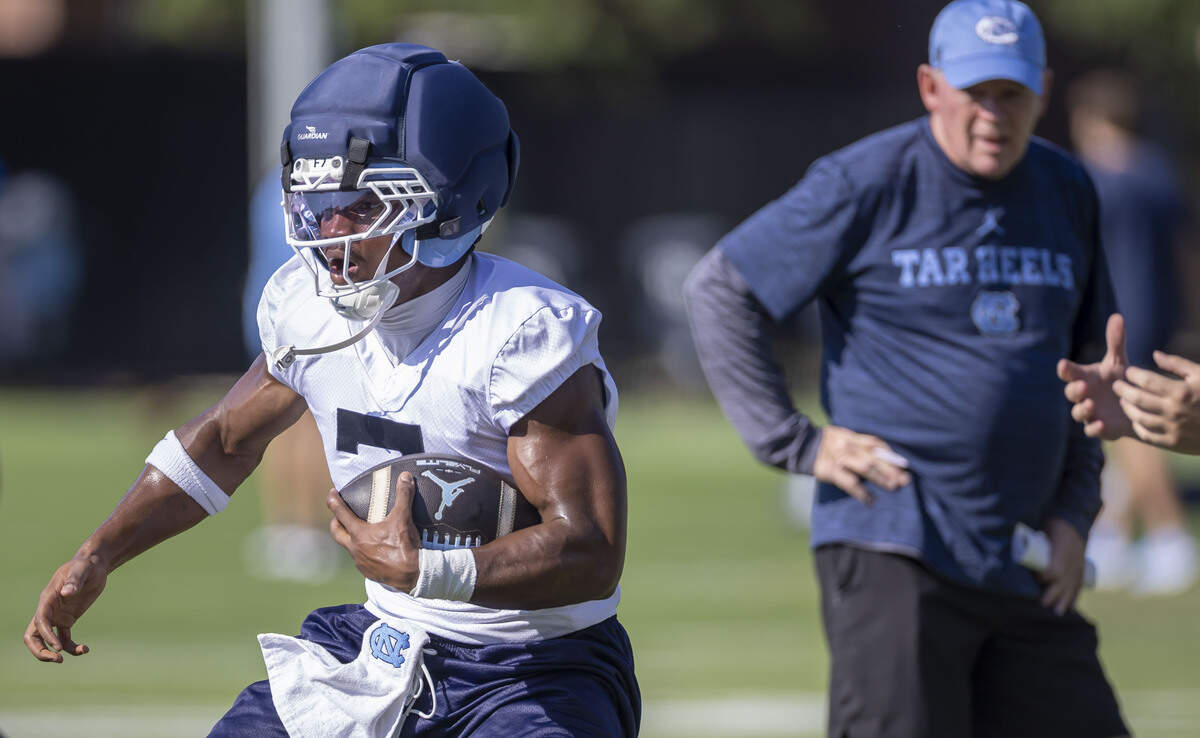 North Carolina offensive coordinator Bobby Petrino watches running back Benjamin Hall (7) carry the ball on the opening day of practice, on Thursday, July 30, 2026 in Chapel Hill, N.C.
