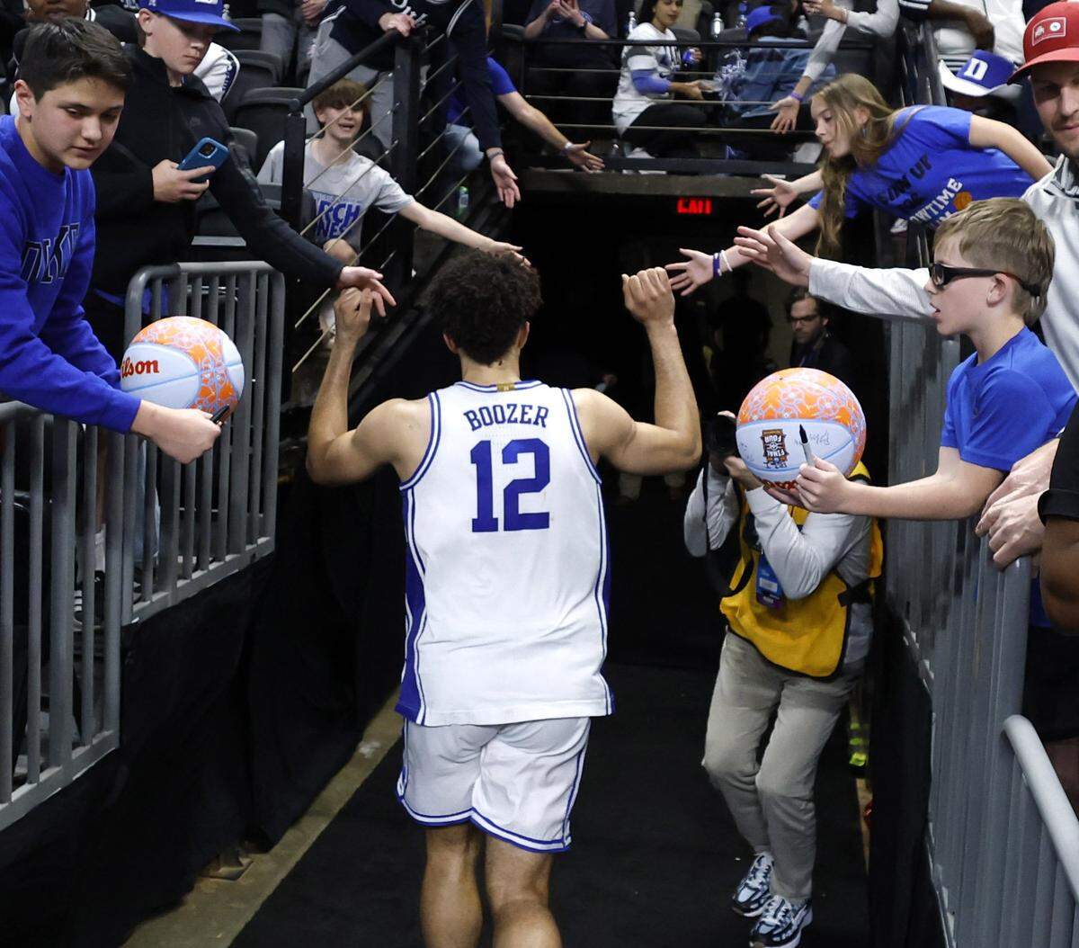 Duke’s Cameron Boozer (12) heads to the locker room after Duke’s 71-65 victory over Siena in the first round of the NCAA Men’s Basketball Tournament at  Bon Secours Wellness Arena in Greenville, S.C., Thursday, March 19, 2026.