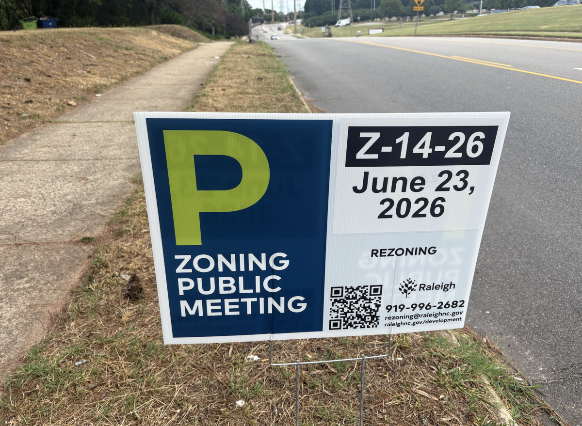 A rezoning sign outside Rhyne’s Gate Apartments in West Raleigh,