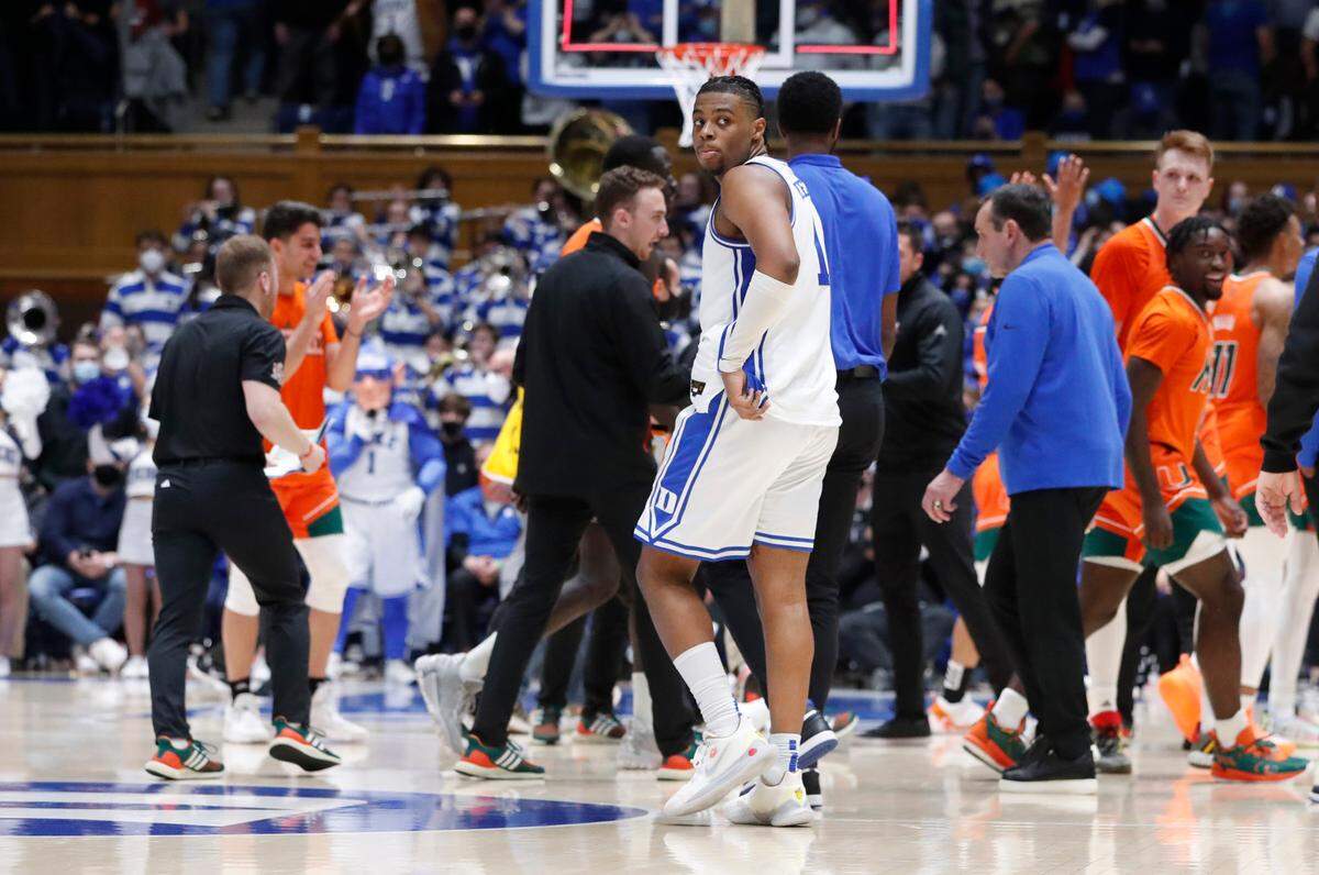 Duke’s Trevor Keels (1) and head coach Mike Krzyzewski walk off the court after Miami’s 76-74 victory over Duke at Cameron Indoor Stadium in Durham, N.C., Saturday, January 8, 2022.