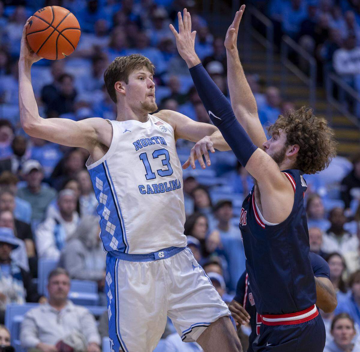 Radford forward Louie Jordan (6) traps North Carolina center Henri Veesaar (13) in the first half on Tuesday, November 11, 2025 at the Smith Center in Chapel Hill, N.C.
