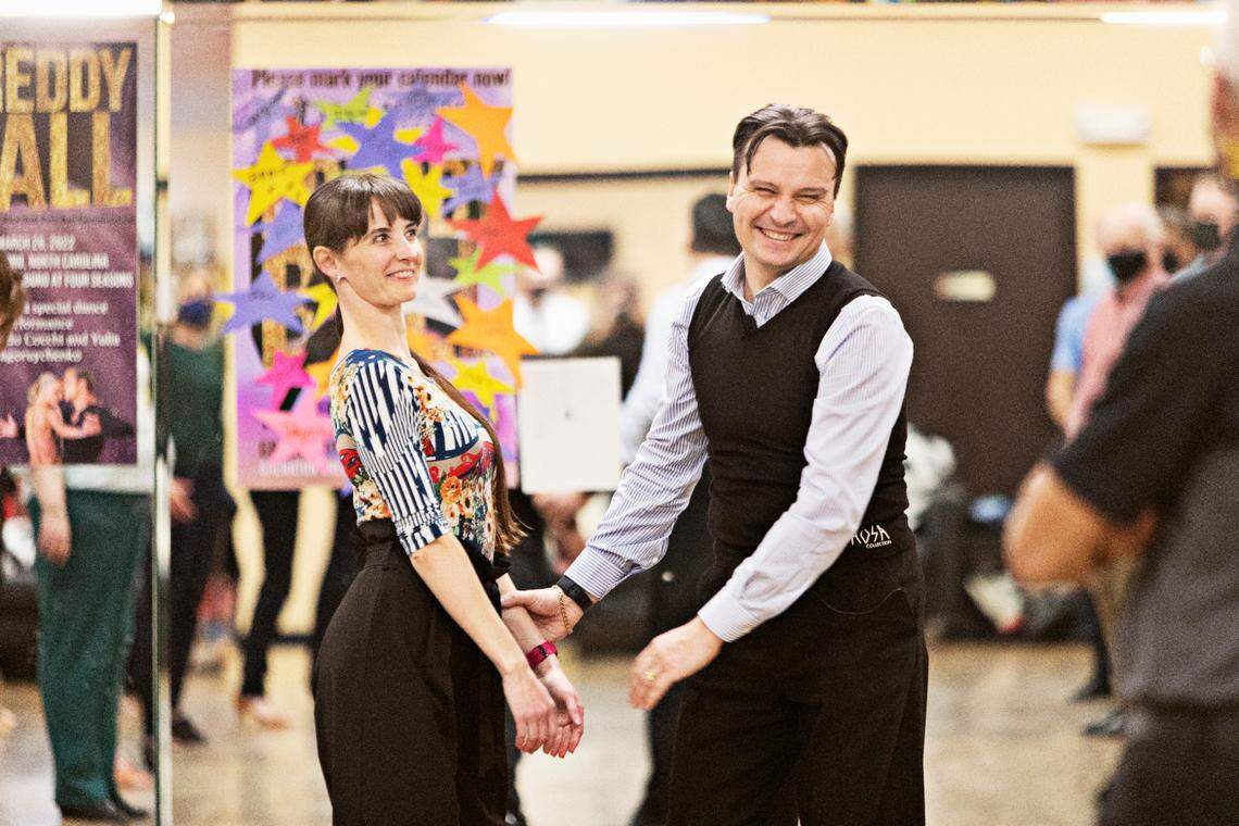 Ruslan Golovashchenko, right, the two-time Ukrainian ballroom dance champion laughs as he teaches a master class at Fred Astaire Dance Studio in Durham on Tuesday, March 1, 2022. Golovashchenko is stranded in Durham while his family escapes Kyiv.