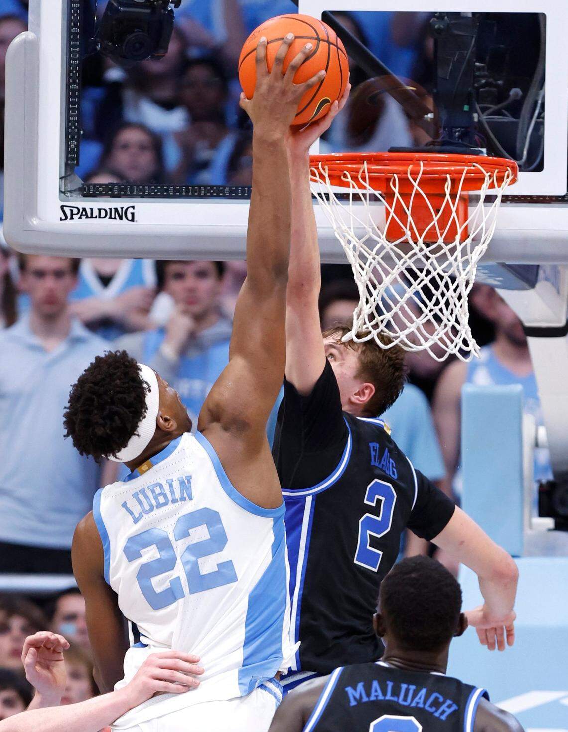 Duke’s Cooper Flagg (2) blocks the shot by North Carolina’s Ven-Allen Lubin (22) during the second half of Duke’s 82-69 victory over UNC at the Smith Center in Chapel Hill, N.C., Saturday, March 8, 2025.
