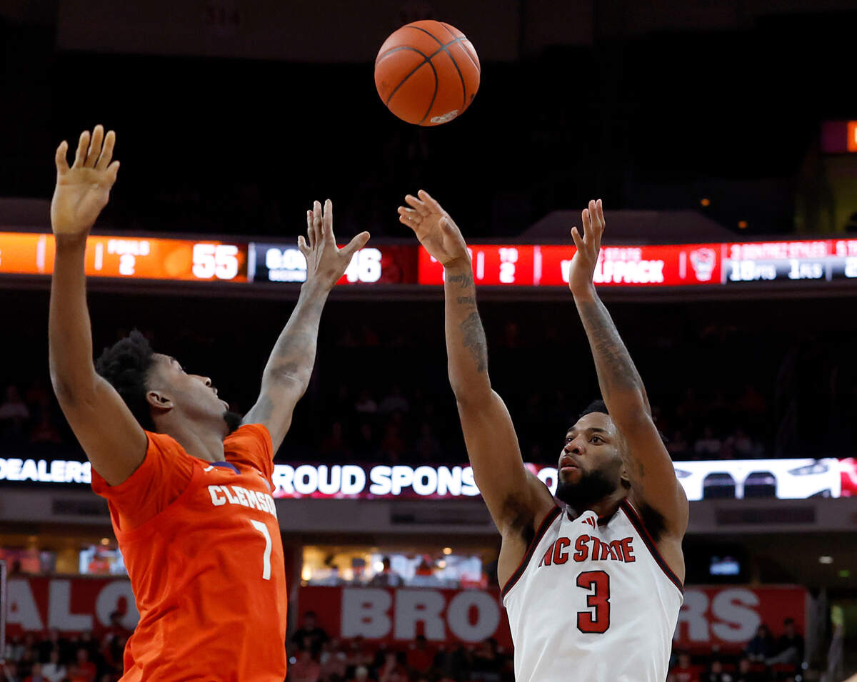 N.C. State’s Dontrez Styles shoots over Clemson’s Chauncey Wiggins during the second half of the Wolfpack’s 68-58 loss on Saturday, Feb. 1, 2025, at Lenovo Center in Raleigh, N.C.