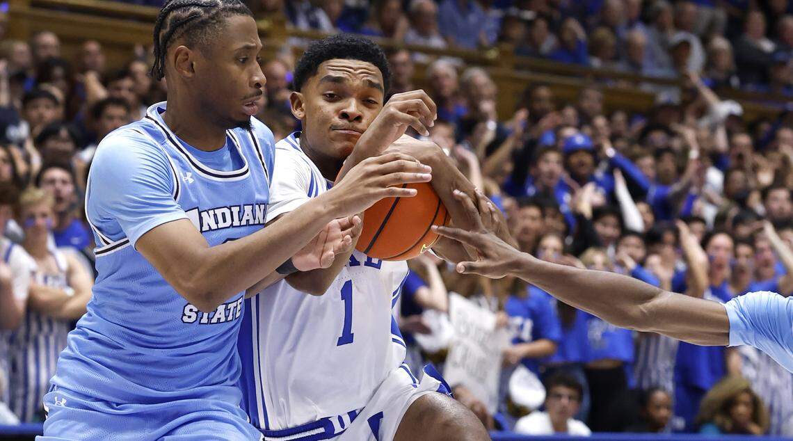 Duke’s Caleb Foster (1) drives between Indiana State's Sterling Young (0), left and Xavier Hall (30) during the second half of Duke’s 100-62 victory over Indiana State at Cameron Indoor Stadium in Durham, N.C., Friday, Nov. 14, 2025.