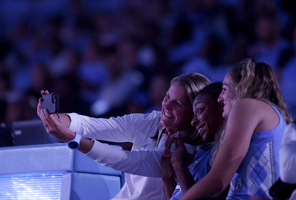 North Carolina women’s basketball head coach Courtney Banghart takes a selfie with players during “Live Action with Carolina Basketball” at the Dean E. Smith Center on Friday, Oct. 7, 2022, in Chapel Hill, N.C.