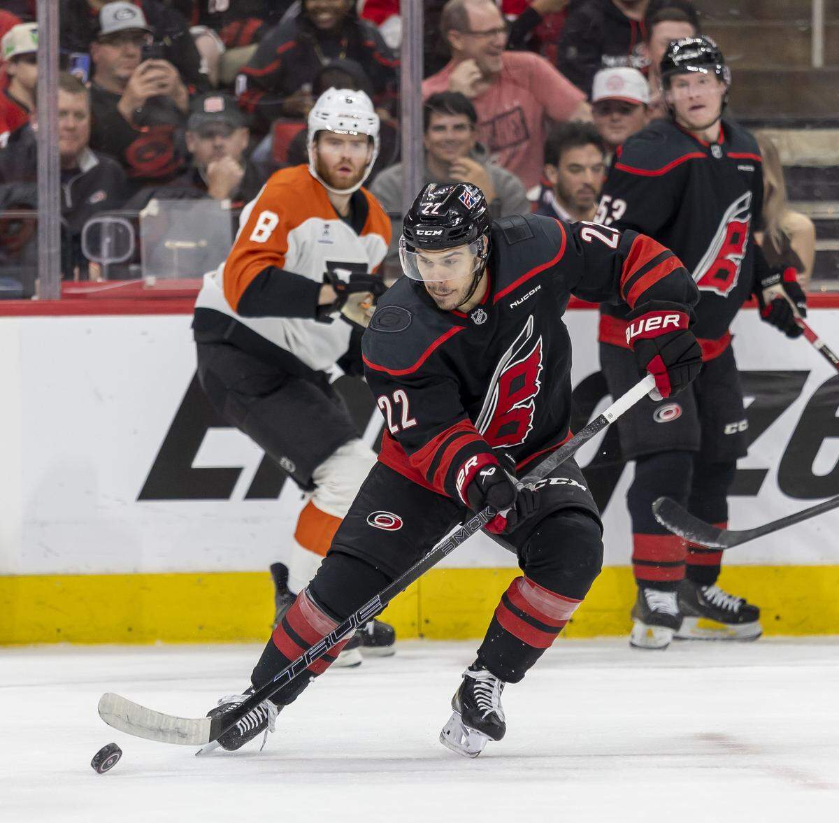 Carolina Hurricanes center Logan Stankoven (22) clears the puck from the boards in the first period against Philadelphia, during Game 1 on Saturday, May 2, 2026, during the second round of the Stanley Cup Playoffs at Lenovo Center in Raleigh, N.C.