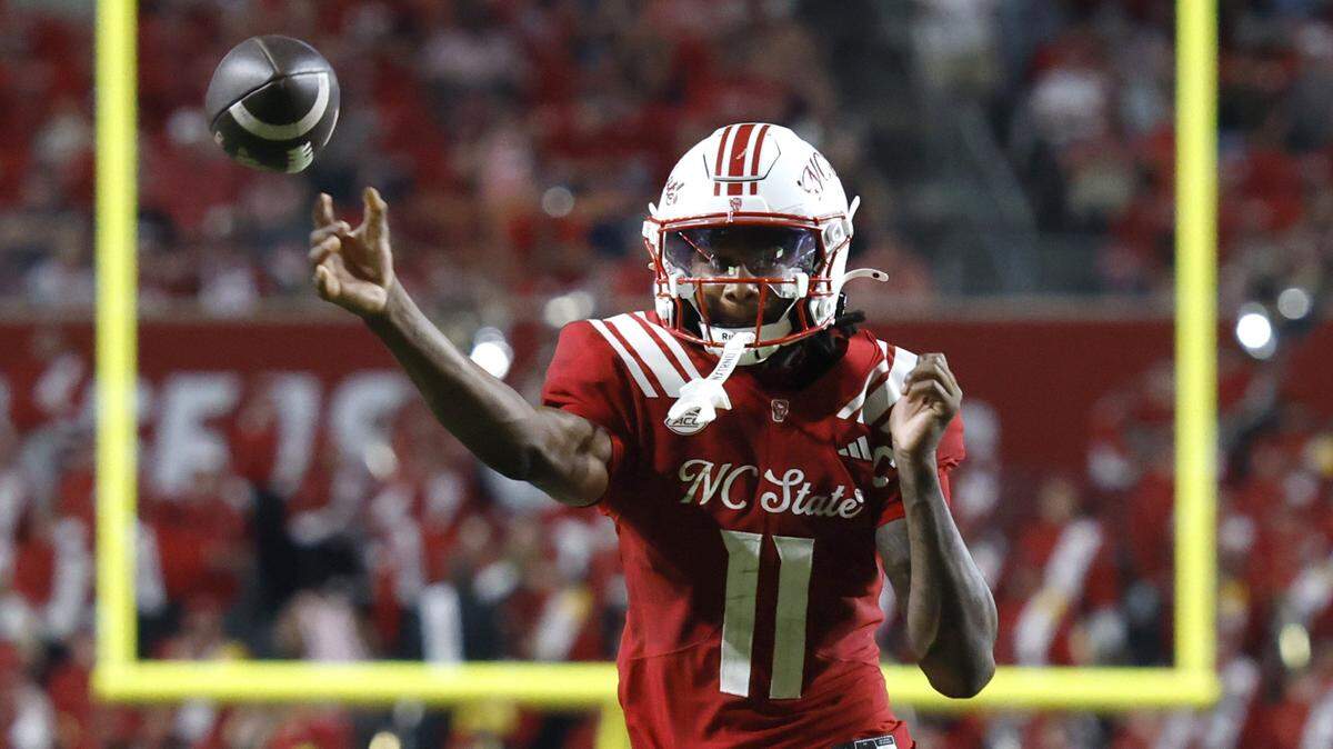 N.C. State quarterback CJ Bailey (11) throws during the second half of N.C. State’s 24-17 victory over ECU at Carter-Finley Stadium in Raleigh, N.C., Thursday, August 28, 2025.