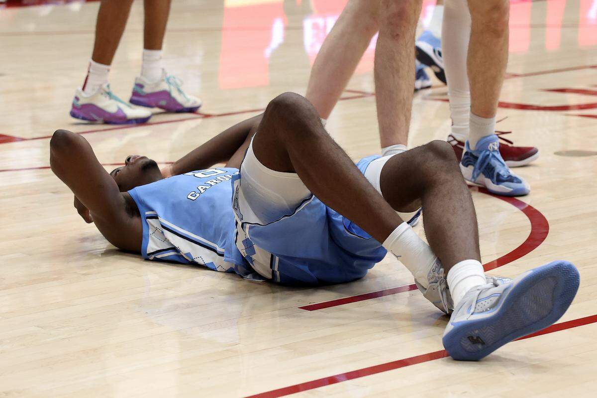 UNC’s Caleb Wilson lies on the court after he was called for a travel on the last play of the Tar Heels’ lost to Stanford at Stanford Maples Pavilion on January 14, 2026 in Palo Alto, California.