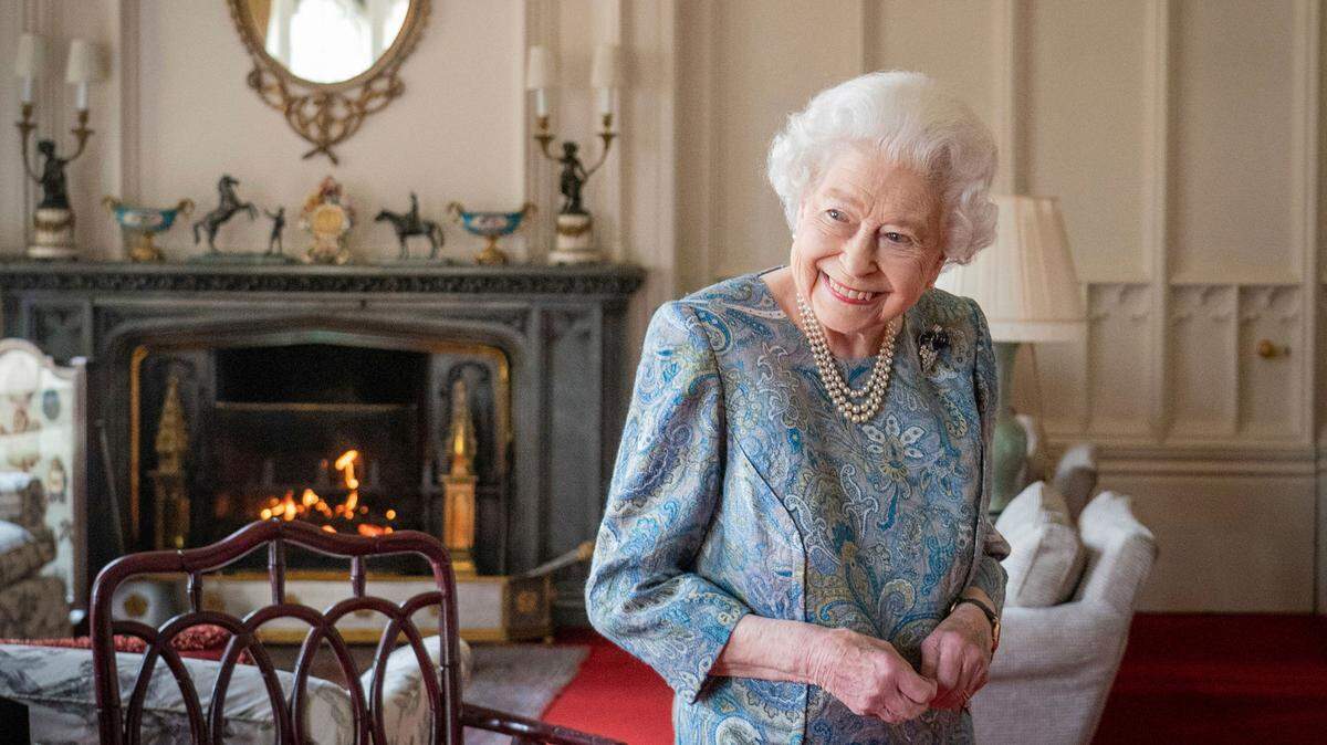 Britain’s Queen Elizabeth II smiles while receiving the President of Switzerland Ignazio Cassis and his wife Paola Cassis during an audience at Windsor Castle in Windsor, England, April 28, 2022.