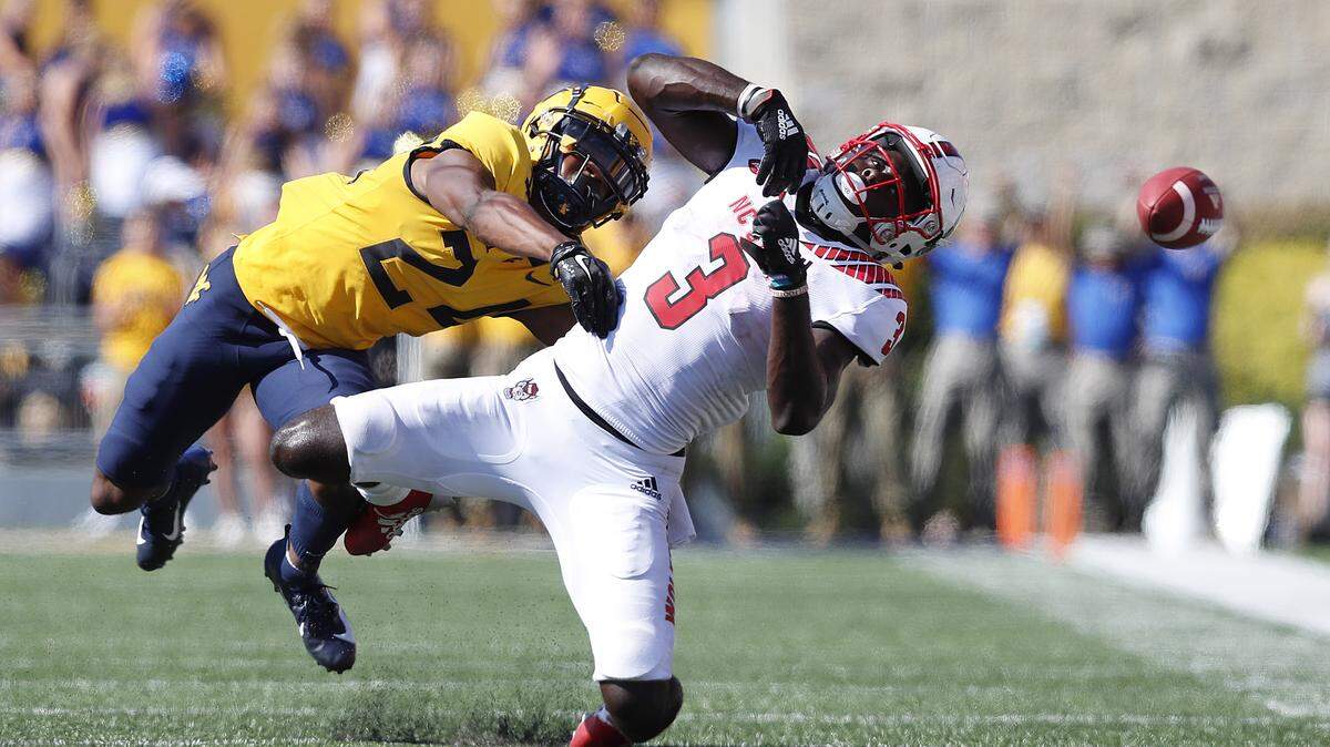 N.C. State wide receiver Emeka Emezie (3) can’t pull in the pass while defended by West Virginia cornerback Hakeem Bailey (24) during the second half of West Virginia’s 44-27 victory over N.C. State at Milan Puskar Stadium in Morgantown, W.V., Saturday, Sept. 14, 2019.