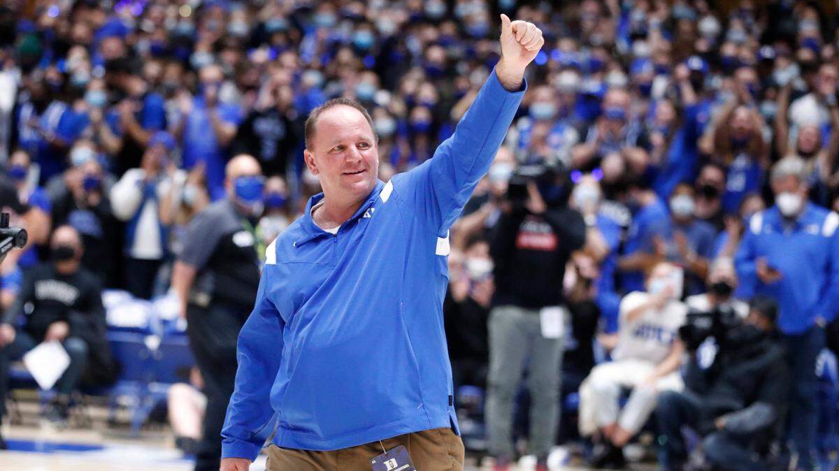 New Duke football coach Mike Elko acknowledges the crowd as he is introduced during Duke basketball game against S.C. State at Cameron Indoor Stadium in Durham, N.C., Tuesday, December 14, 2021.