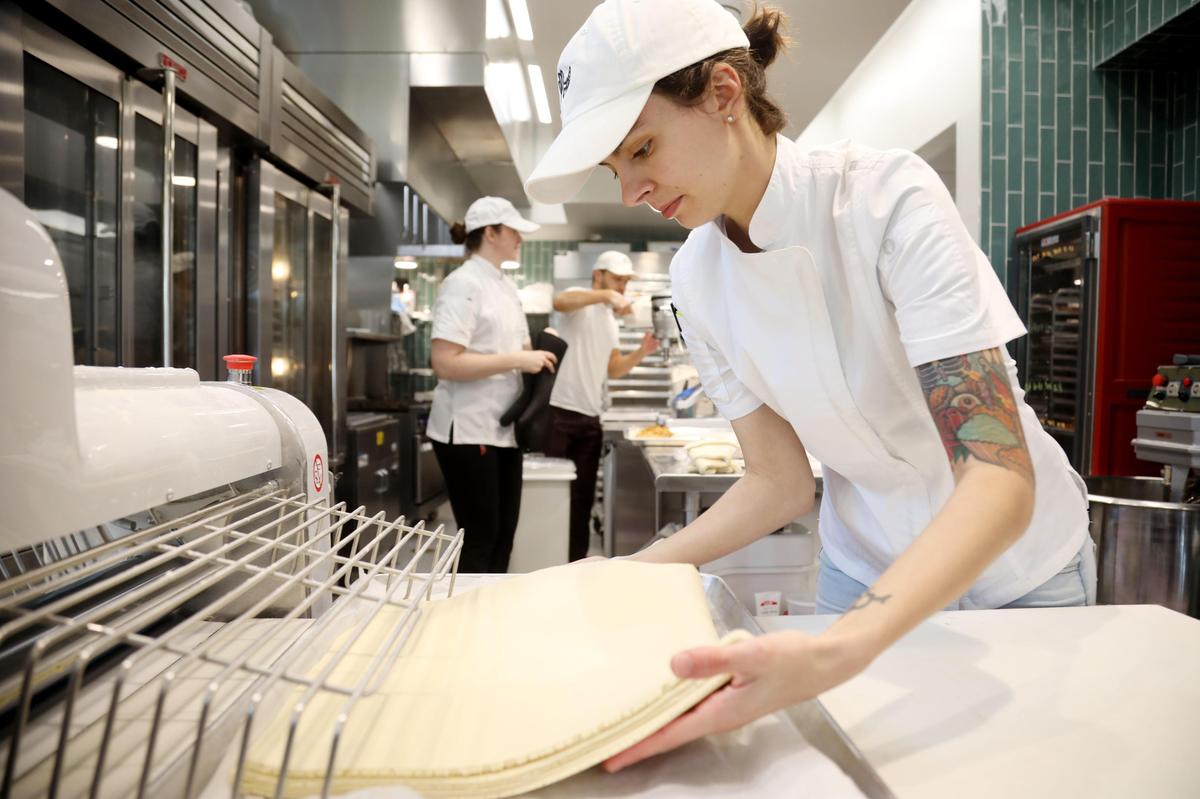 Layered Croissanterie owner/baker Kawsar Chavez and her crew create pastry art behind floor-to-ceiling glass.