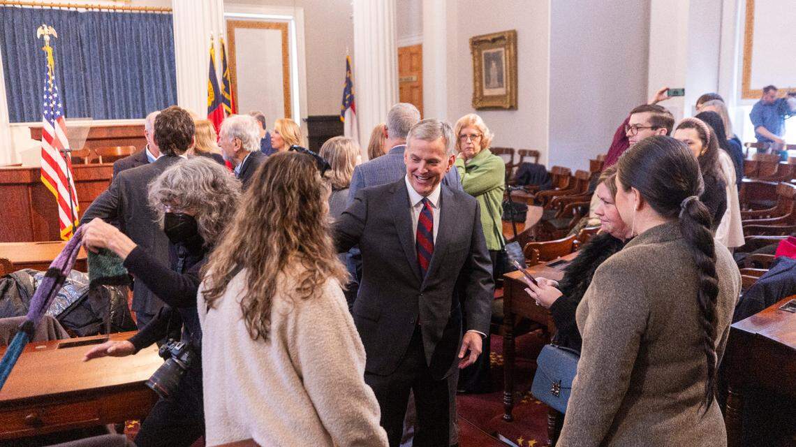 North Carolina Democratic Gov. Josh Stein talks with supporters after delivering his inauguration address inside the House chamber of the historic State Capitol on Saturday, Jan. 11, 2025.