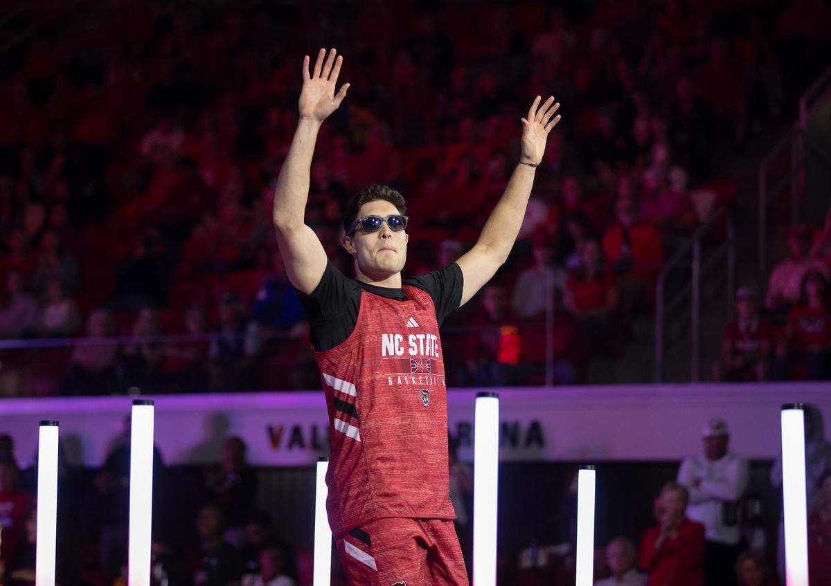 N.C. State’s Michael O’Connell acknowledges the crowd as he is introduced during the Primetime with the Pack preseason event on Friday, Oct. 25, 2024, at Reynolds Coliseum in Raleigh, N.C.