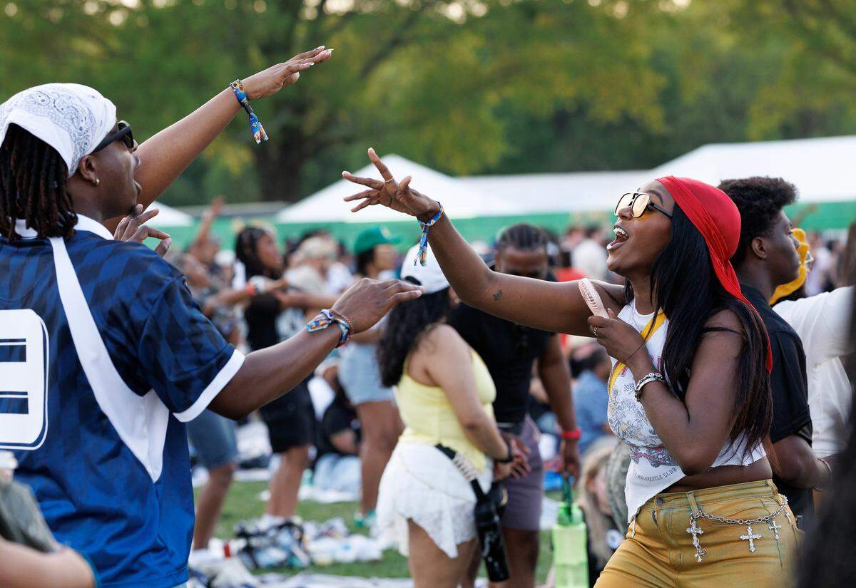 Jessica Flax, right, sings along during Keyshia Cole’s performance at the fifth Dreamville Festival on Saturday, April 5, 2025, at Dorothea Dix Park in Raleigh, N.C.