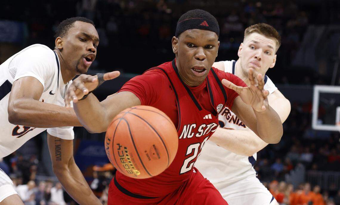 N.C. State's Ven-Allen Lubin (22) goes after a loose ball in the second half of Virginia’s 81-74 victory over N.C. State in the quarterfinals of the 2026 ACC Men’s Basketball Tournament at the Spectrum Center in Charlotte, N.C., Thursday, March 12, 2026.