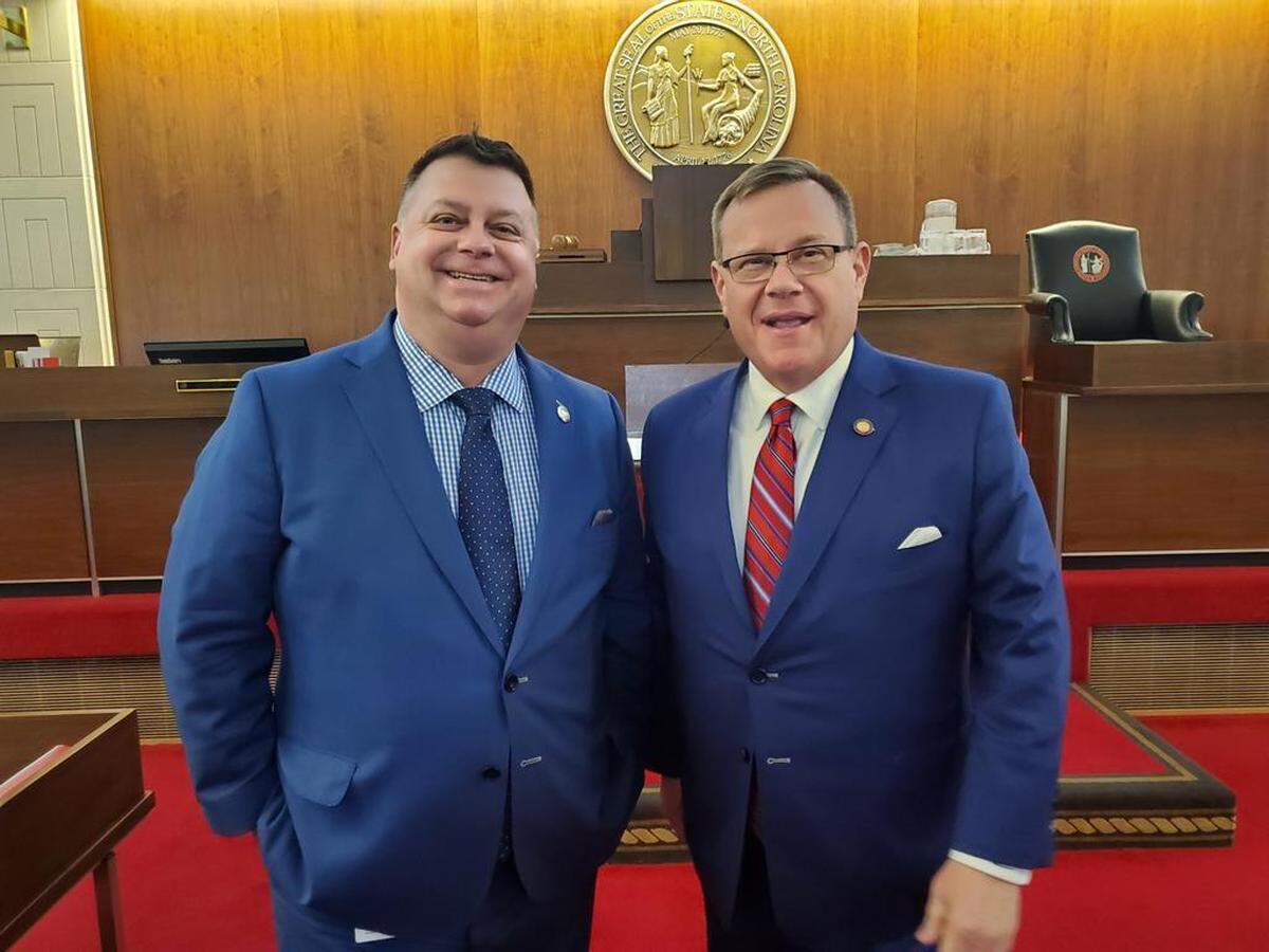 North Carolina state Rep. Jason Saine, left, who chairs the powerful Appropriations Committee, and House Speaker Tim Moore, both Republicans.