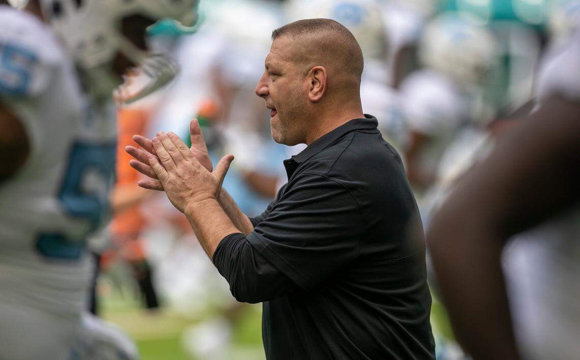 North Carolina offensive coordinator Phil Longo applauds as the Tar Heels warm up for their game against Miami on Saturday, October 8, 2022 at Hard Rock Stadium in Miami Gardens, Florida.