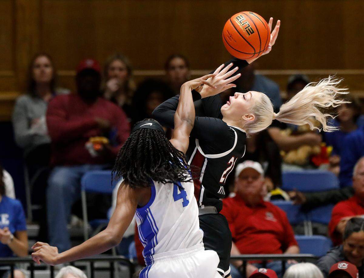 South Carolina’s Chloe Kitts is fouled by Duke’s Jadyn Donovan during the first half of the Blue Devils’ game on Sunday, Dec. 3, 2023, at Cameron Indoor Stadium in Durham, N.C.