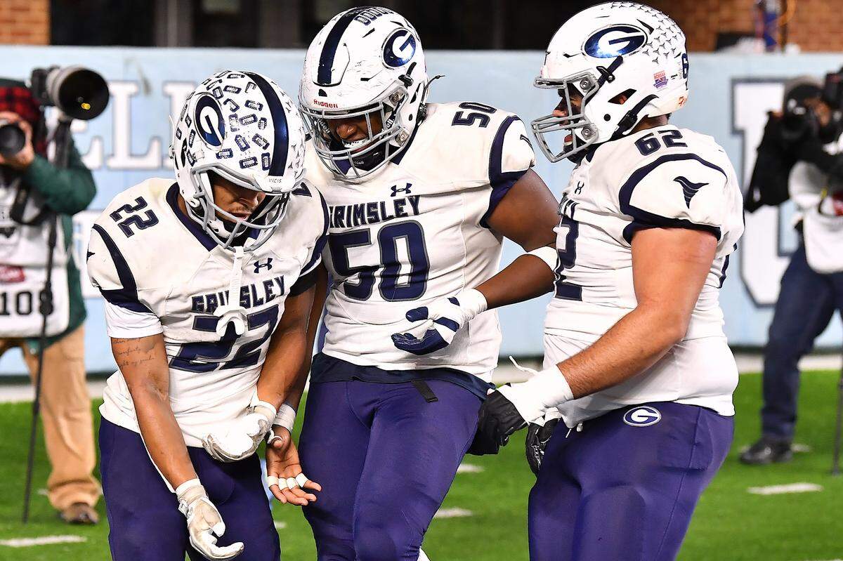 Grimsley running back Mitchell Summers (22) celebrates with teammates after scoring the touchdown against Rolesville during the first half. The Rolesville Rams and the Greensboro Grimsley Whirlies met in the NCHSAA 4A football Championship Game in Chapel Hill, N.C. on December 20, 2024.