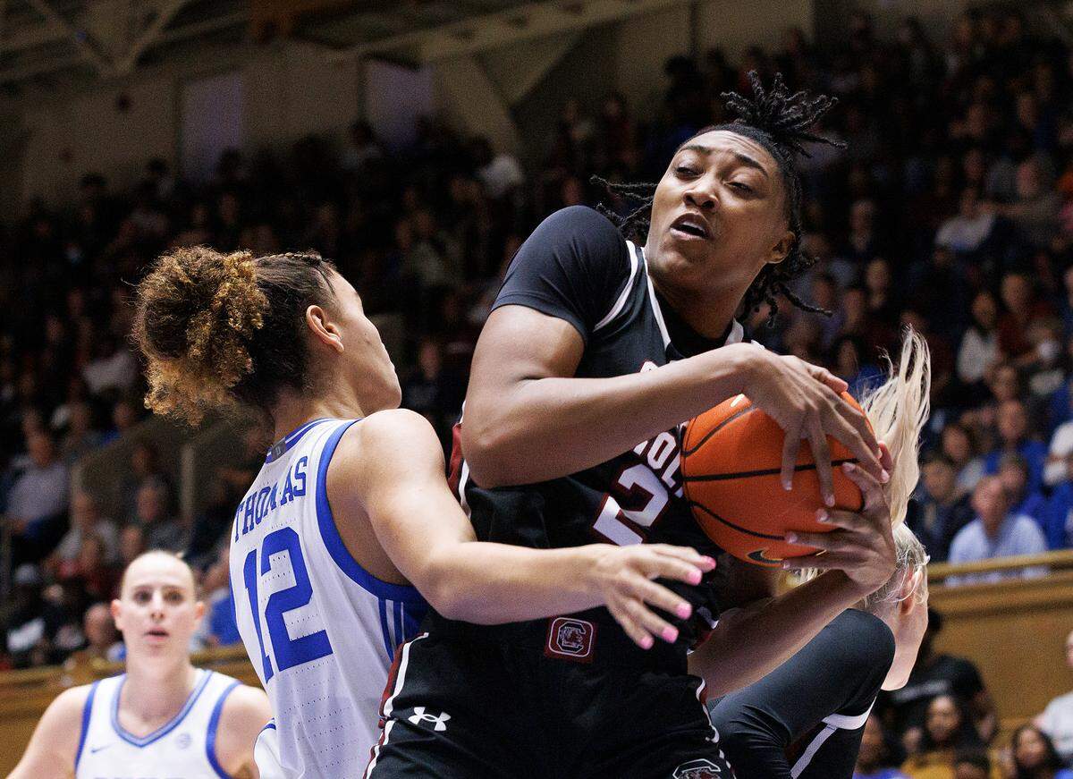 South Carolina’s Ashlyn Watkins pulls down a rebound away from Duke’s Delaney Thomas during the second half of the Blue Devils’ 77-61 loss on Sunday, Dec. 3, 2023, at Cameron Indoor Stadium in Durham, N.C.