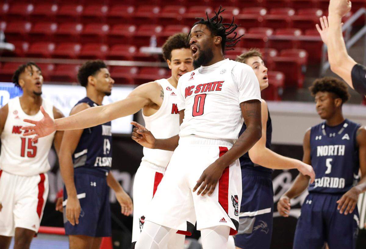 N.C. State’s D.J. Funderburk (0) celebrates after making the shot while being fouled during the first half of N.C. State’s game against North Florida in the Mako Medical Wolfpack Invitational at Reynolds Coliseum in Raleigh, N.C., Friday, Nov. 27, 2020.
