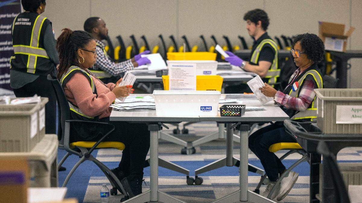 Wake County Board of Elections employees process ballots from the 2024 election on Wednesday, Nov. 13, 2024 in Raleigh, N.C.