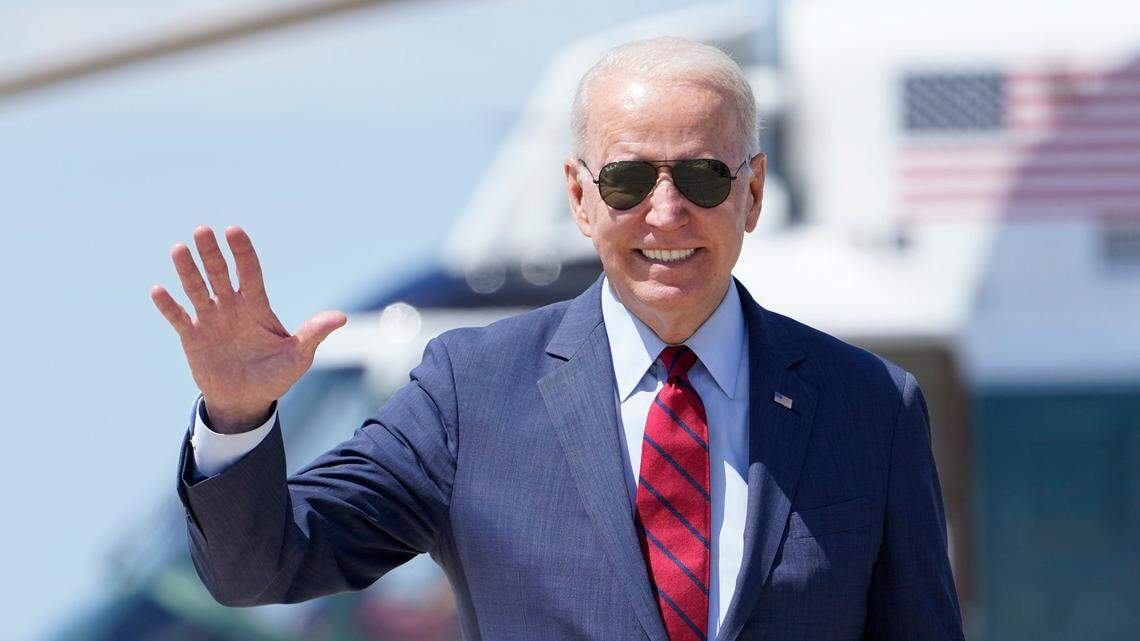 President Joe Biden waves before walking up the steps of Air Force One at Andrews Air Force Base, Md., in June 2021. Biden will be in Greensboro on Thursday.