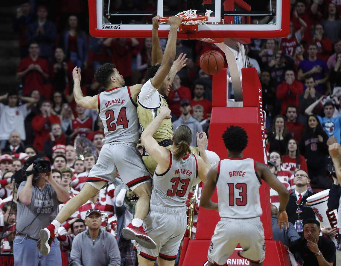 Georgia Tech’s James Banks III (1) scores while being fouled by N.C. State’s Devon Daniels (24) in the final seconds of Georgia Tech 63-61 victory over N.C. State at PNC Arena in Raleigh, N.C., Wednesday, March, 6, 2019.
