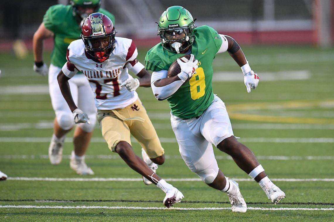 Cardinal Gibbons running back Noah Terry (8) sprints for the touchdown ahead of Mallard Creek's Jordan Isaiah (27) during the first half. The Mallard Creek Mavericks and the Cardinal Gibbons Crusaders met in a non-conference football game in Raleigh, N.C. September 19, 2025