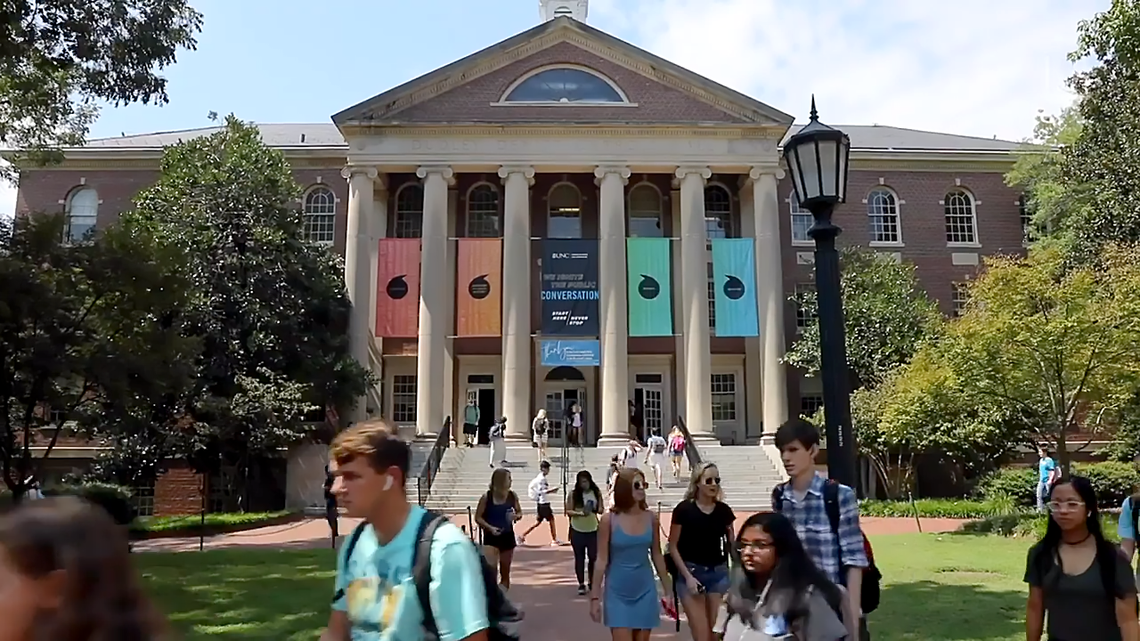 Students pass UNC Chapel Hill’s Hussman School of Journalism and Media. In 2019, Arkansas publisher Walter Hussman Jr. pledged $25 million to the journalism school and had it named for him. Now, some faculty are angry over Hussman’s meddling in the hiring of Nikole Hannah-Jones.