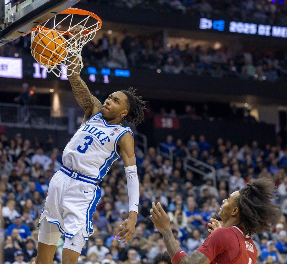 Duke forward Maliq Brown (6) dunks over Alabama’s Labaron Philon (0) in the first half on Saturday, March 29, 2025 during the NCAA East Regional final at Prudential Center in Newark, N.J.