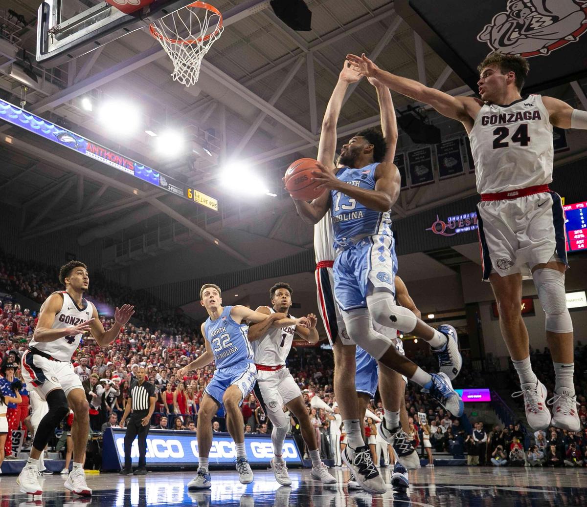 Gonzaga’s Drew Timme (2) and Corey Kispert (24) defend North Carolina’s Jeremiah Francis (13) during the second half on Wednesday, December 18, 2019 at McCarthey Athletic Center in Spokane, Washington.