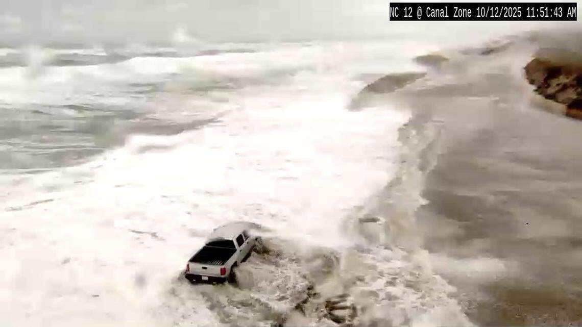 A driver braves standing water on N.C. 12 south of Oregon Inlet, near Rodanthe, on Sunday as a nor’easter’s high winds and heavy surf sent sand and ocean water onto the highway. Sections of N.C. 12 on Hatteras and Ocracoke islands remained closed Monday, but crews were working to clear the highway and check for damage.