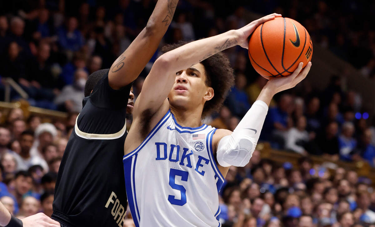 Duke’s Tyrese Proctor (5) drives to the basket as Wake Forest’s Daivien Williamson (4) defends during the second half of Duke’s 75-73 victory over Wake Forest at Cameron Indoor Stadium in Durham, N.C., Tuesday, Jan. 31, 2023.
