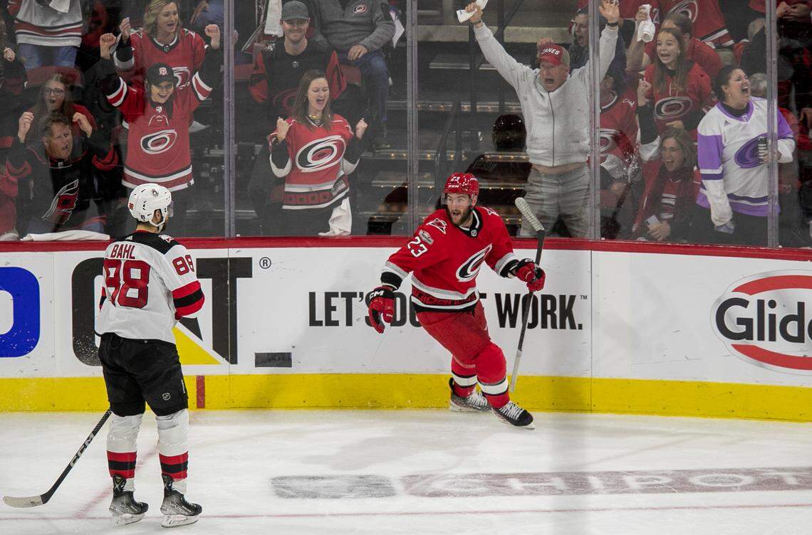 The Carolina Hurricanes Stefan Noesen (23) reacts after scoring on New Jersey Devils Vivek Vanecek (41) to cap a 6-1 victory in the third period during Game 2 of their second round Stanley Cup playoff series on Friday, May 5, 2023 at PNC Arena in Raleigh, N.C.