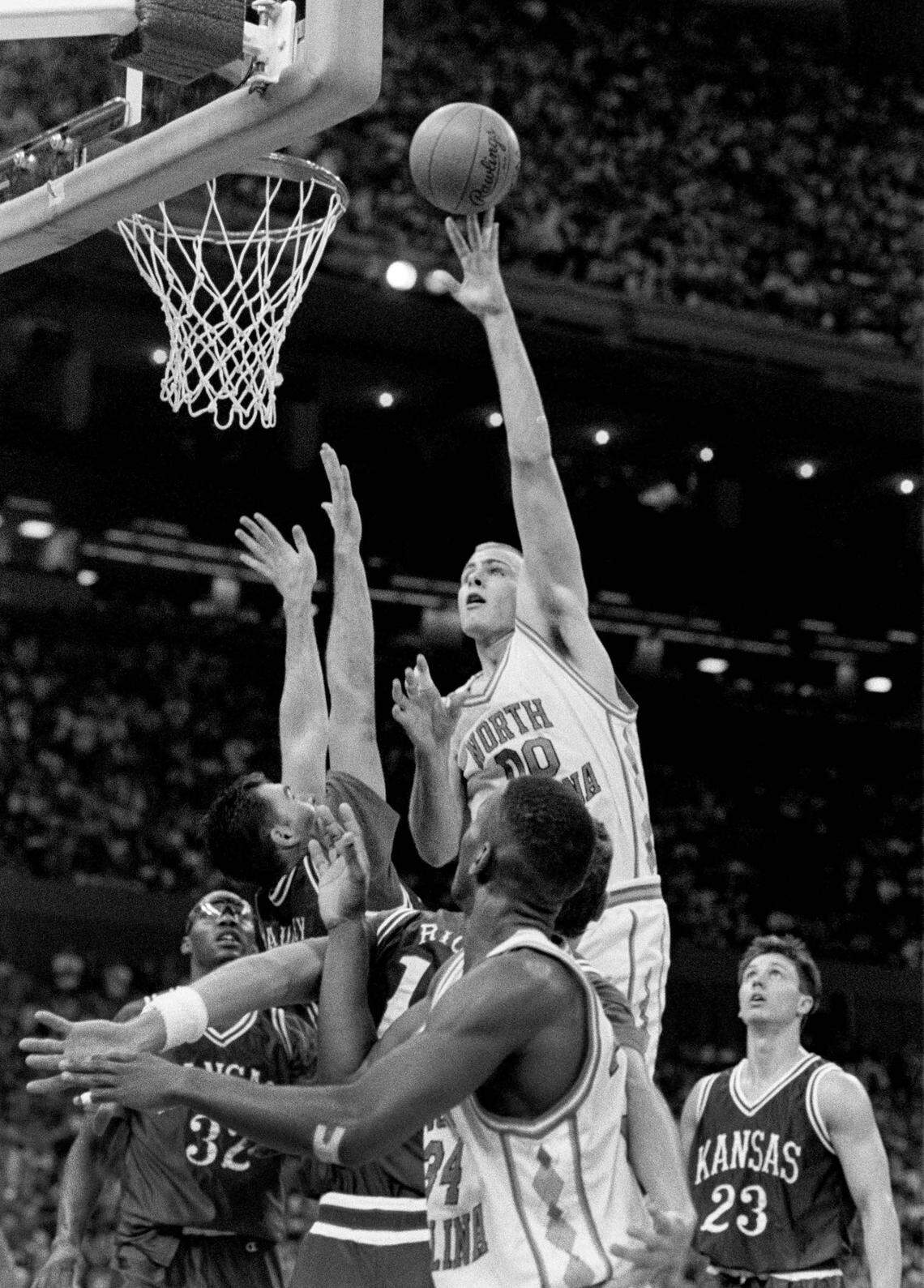 UNC’s Eric Montross shoots over Kansas defenders in the NCAA semis in1993.