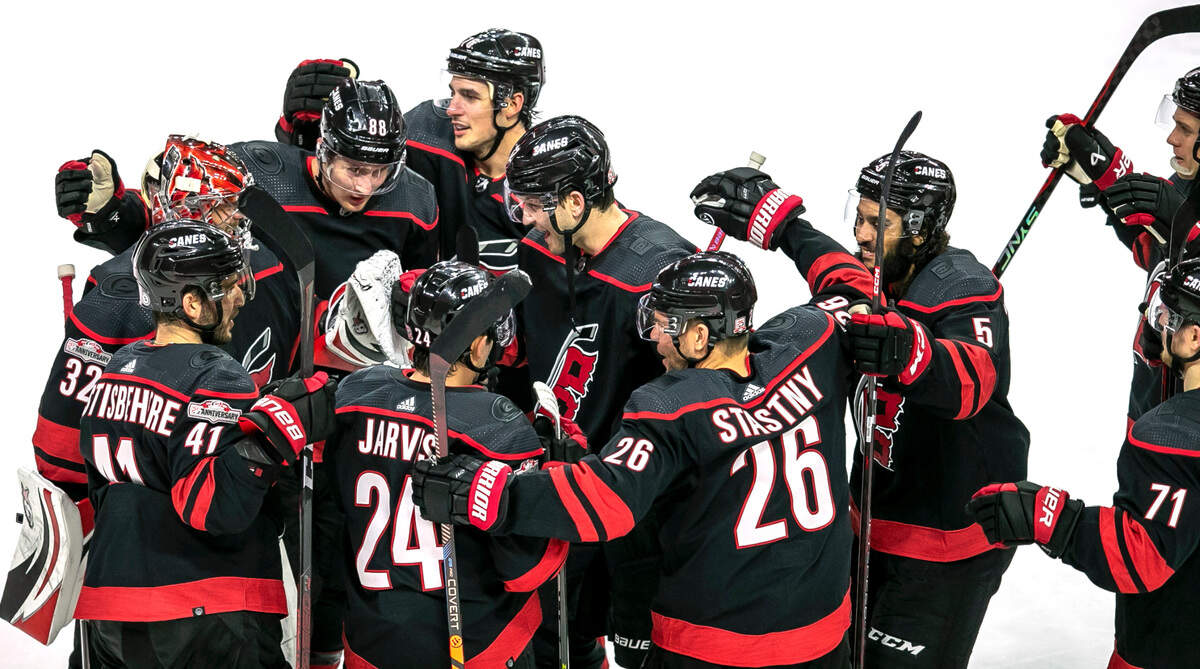 Carolina’s Hurricanes’ Martin Necas (88) is surrounded by teammates after scoring the game winning goal in overtime to secure a 3-2 victory over Ottawa on Tuesday, April 4, 2023 at PNC Arena in Raleigh, N.C.