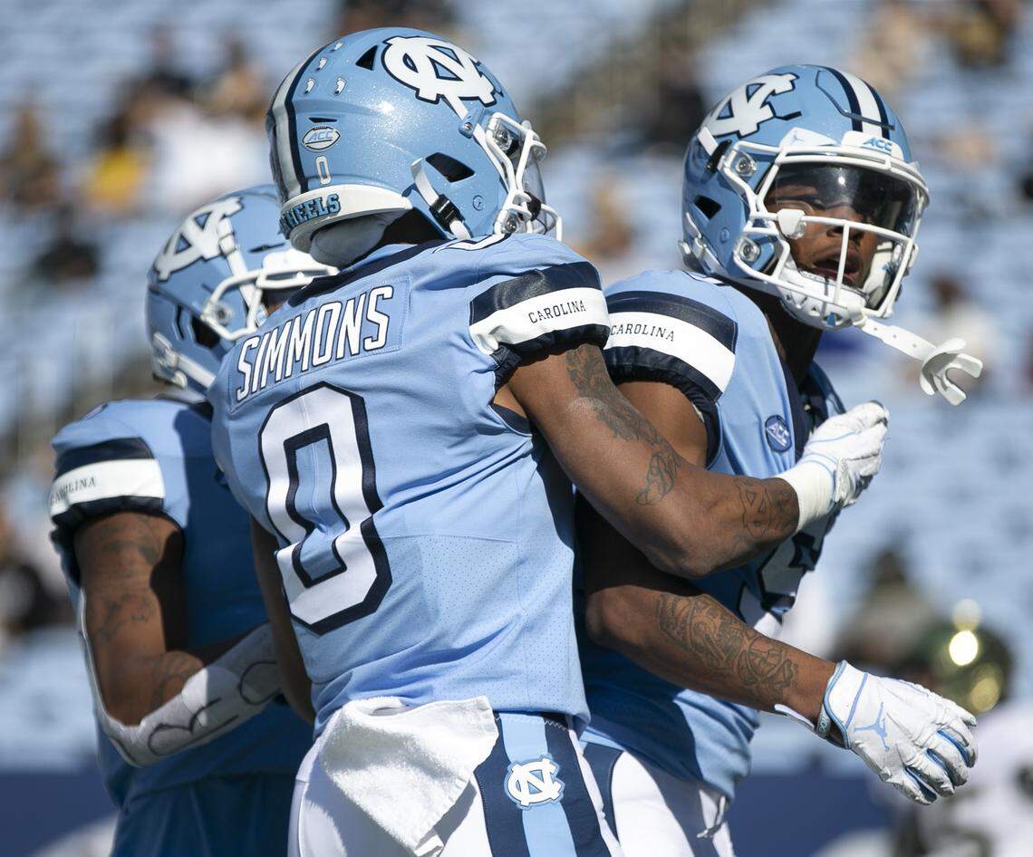 North Carolina’s Dazz Newsome (5) celebrates with teammates after scoring on a 75-yard pass completion from quarterback Sam Howell in the first quarter against Wake Forest at Kenan Stadium on Saturday, November 14, 2020 in Chapel Hill, N.C.