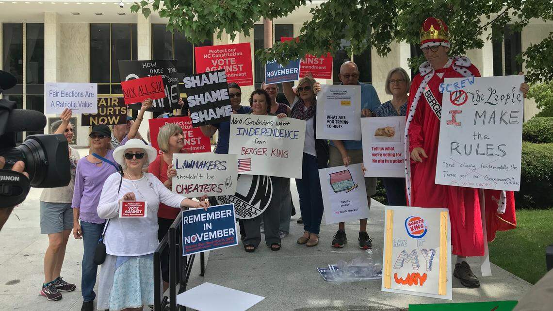 Protesters at the General Assembly on Saturday, Aug. 4, 2018, opposed Republican legislators’ plan to override two vetoes from Democratic Gov. Roy Cooper. Cooper was attempting to block two new laws from affecting this November’s elections. One bill affects the N.C. Supreme Court race, and the other affects how six proposed constitutional amendments are described to voters.