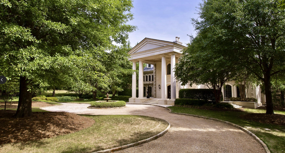 Outside the luxury home with 16,000-plus square feet, saltwater pool and a bullet-proof safe room.