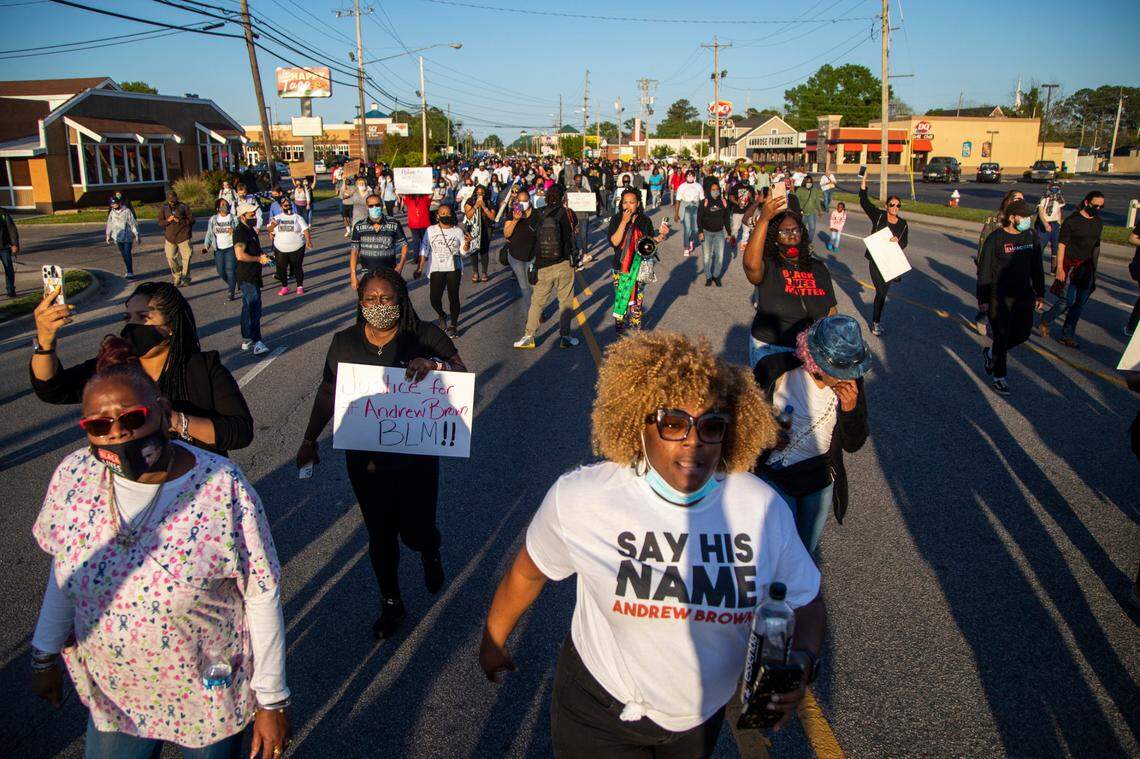 Demonstrators march peacefully in Elizabeth City on Monday April 26, 2021 after family viewed 20 seconds of police body camera video of the shooting death of Andrew Brown Jr.