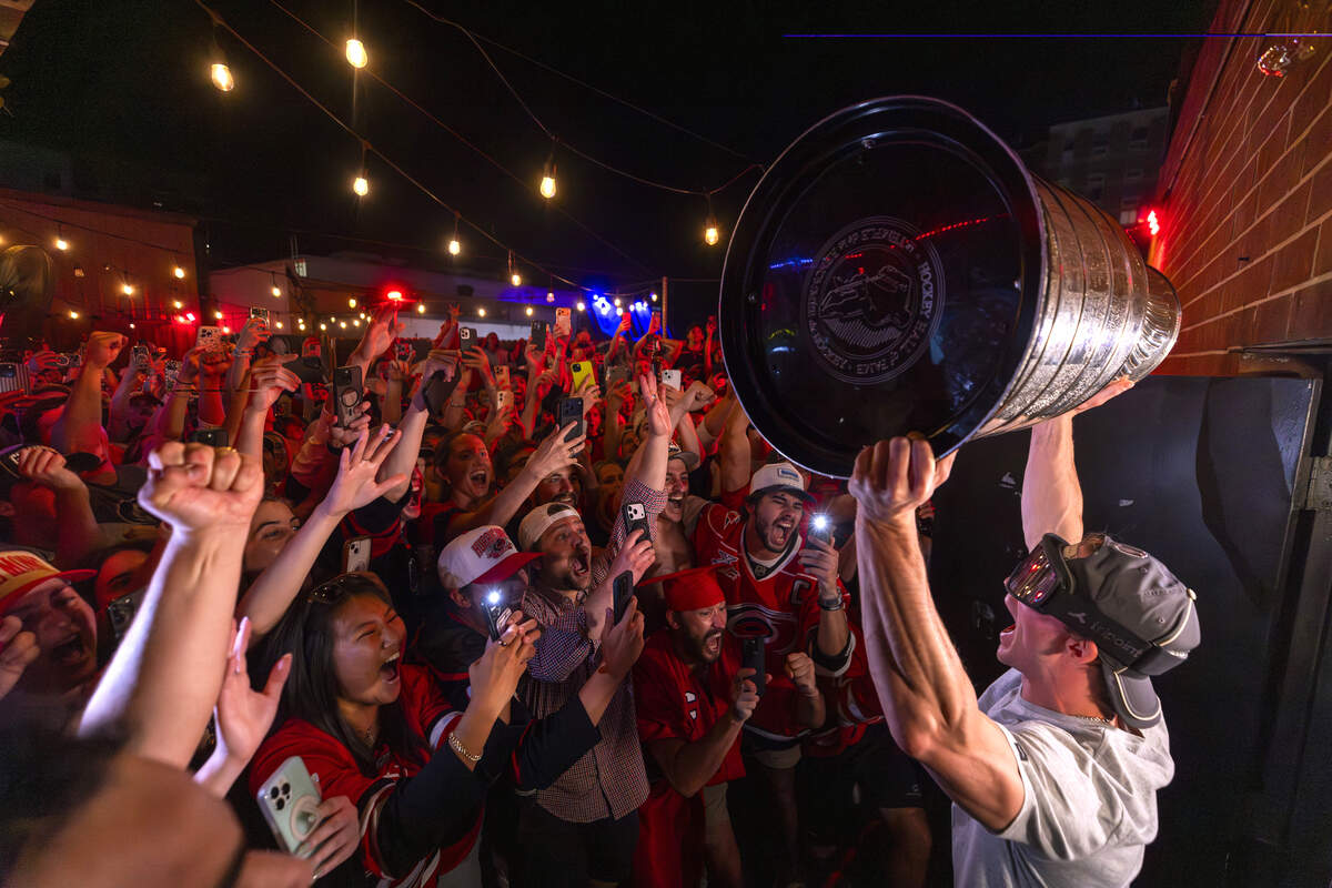 Carolina Hurricanes fans celebrate the team's Stanley Cup Final victory at Teets in Raleigh's Glenwood South district as the Stanley Cup, accompanied by Hurricanes players and staff, makes an appearance during a victory celebration Monday, June 15, 2026. The Hurricanes defeated the Vegas Golden Knights 4-2 in the Stanley Cup Final to win the franchise's second championship since 2006.