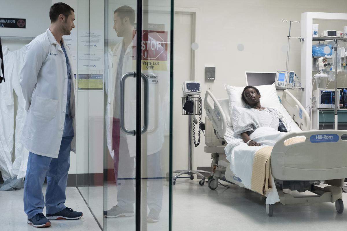 Ryan Eggold, left, as Dr. Max Goodwin, and Jason Kisare as Alain in the series premiere of “New Amsterdam” on NBC.