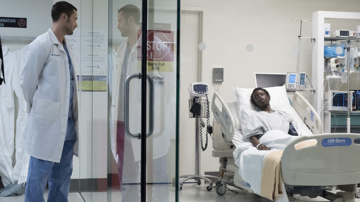 Ryan Eggold, left, as Dr. Max Goodwin, and Jason Kisare as Alain in the series premiere of “New Amsterdam” on NBC.