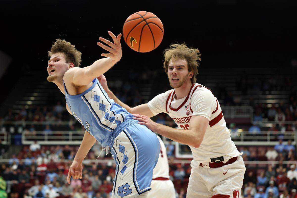 UNC’s Henri Veesaar (13) is fouled by Cameron Grant (20) of Stanford during the first half at Stanford Maples Pavilion on January 14, 2026 in Palo Alto, California.
