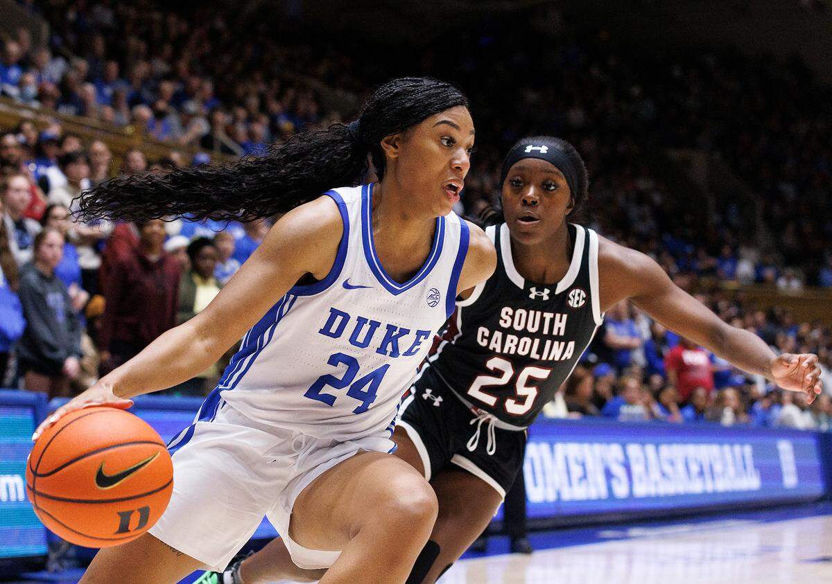 Duke’s Reigan Richardson drives the baseline past South Carolina’s Raven Johnson during the second half of the Blue Devils’ 77-61 loss on Sunday, Dec. 3, 2023, at Cameron Indoor Stadium in Durham, N.C.