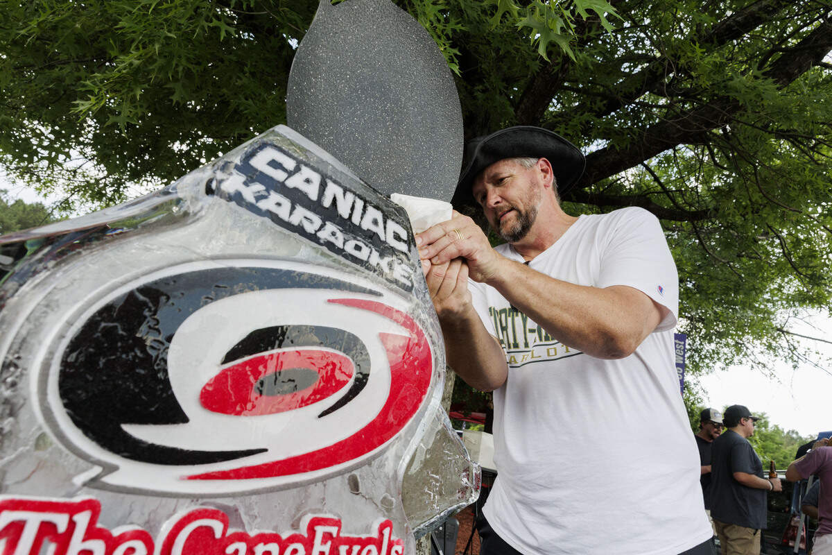 Paul Esterline chisels the edge of the CaneEvels Ice Luge in the parking lot of the Lenovo Center on June 11, 2026, in Raleigh, North Carolina. The Carolina Hurricanes take on the Vegas Golden Knights for Game 5 of the Stanley Cup Final.