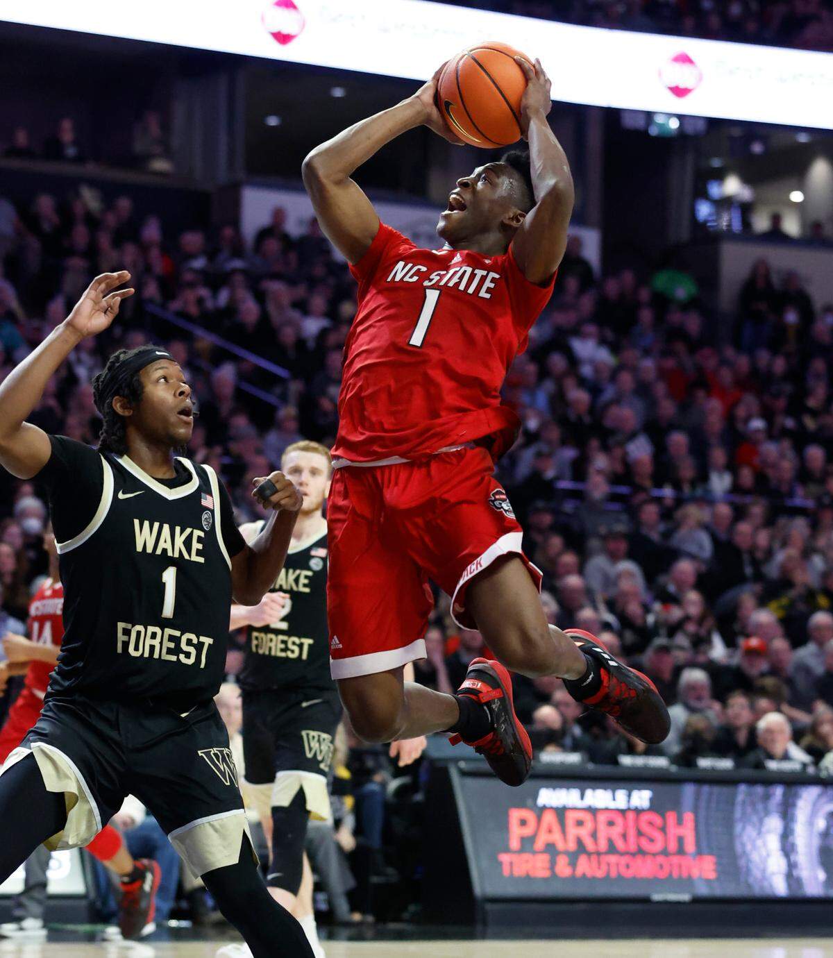 N.C. State’s Jarkel Joiner (1) heads to the basket as Wake Forest’s Tyree Appleby (1) defends during the second half of N.C. State’s 79-77 victory over Wake Forest at Joel Coliseum in Winston-Salem, N.C., Saturday, Jan. 28, 2023.